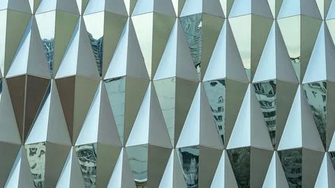 Triangular building facade made of green glass, glass facade of modern buil.. 写真素材