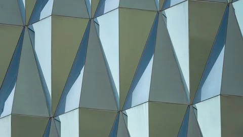 Triangular building facade made of green glass, glass facade of modern buil.. 写真素材