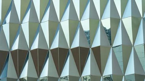Triangular building facade made of green glass, glass facade of modern buil.. 写真素材