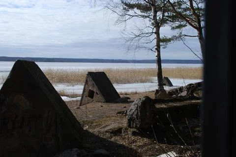 Triangular concrete structures on the river bank. Stock Photos