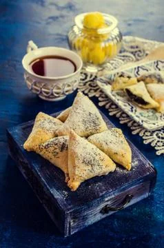 Triangular cookies with poppy seeds Stockfoto's