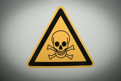 Triangular danger sign with black skull 스톡 사진