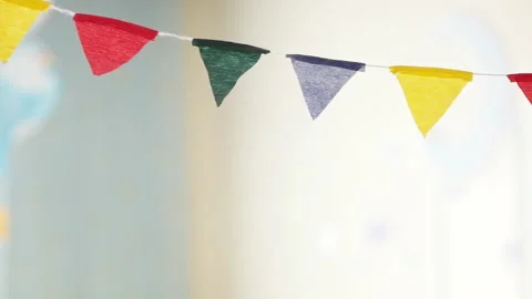 Triangular flags colorful pennant banner crowd control rope against blue sky Stockbeeldmateriaal 175390681