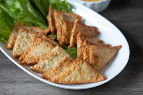 Triangular fried tofu eating with spicy dipping sauce, sweet and spicy Stock Photos