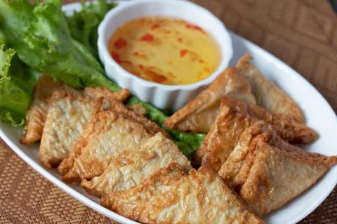 Triangular fried tofu eating with spicy dipping sauce, sweet and spicy Stock Photos