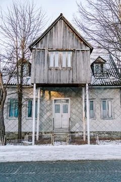 Triangular gazebo on stilts stands above the entrance to the house in the Stock Photos