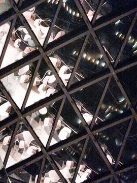 Triangular glass reflections of dining area Stockfoto's