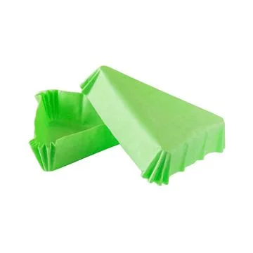 Triangular green paper baking form for cakes Stock Photos