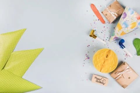 Triangular green paper party items gray background Stock Photos