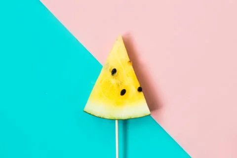Triangular ice cream slices on a stick of ripe yellow watermelon 写真素材