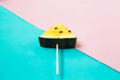 Triangular ice cream slices on a stick of ripe yellow watermelon 写真素材