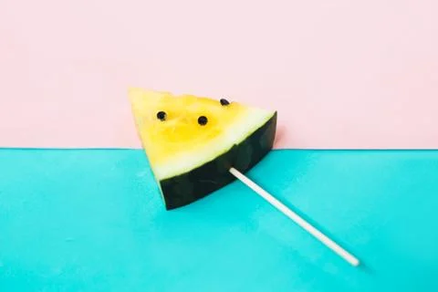 Triangular ice cream slices on a stick of ripe yellow watermelon 写真素材