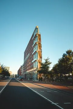 Triangular modern skyscraper on the waterfront in Amsterdam, Holland. Dutch a Stock Photos