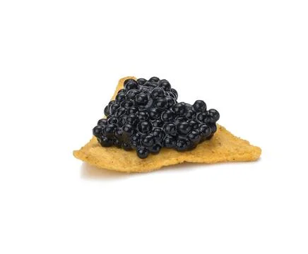 Triangular nachos with black paddlefish caviar isolated on white background.  Stock Photos