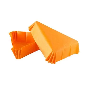 Triangular orange paper baking form for cakes Fotos Stock