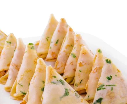 Triangular pancakes with meat on plate Stock Photos