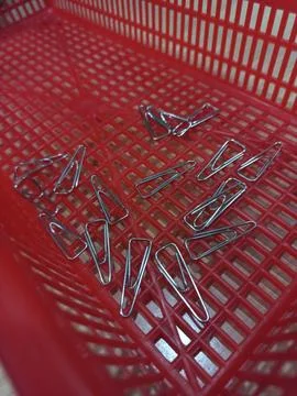 Triangular paper clip on basket red plastic 스톡 사진
