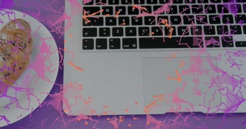 Triangular particles drifting, plate sliding, revealing croissant beside laptop Stock Footage 318476583