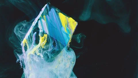 Triangular pastel paint peak dispersing into milky plume against black backgroun Stock Footage 341464867