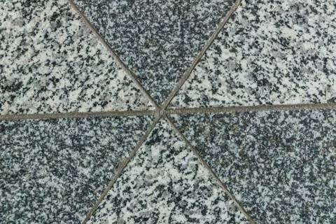 Triangular pattern on the granite floor Stock Photos