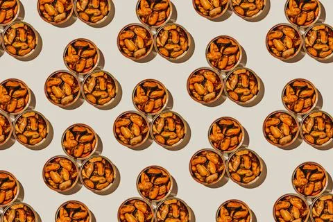 Triangular pattern of mejillones en escabeche tins Stock Photos
