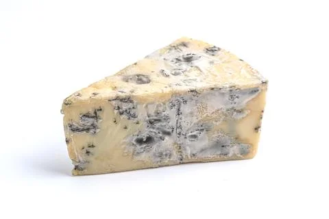 Triangular piece of blue cheese isolated on white. Stock Photos