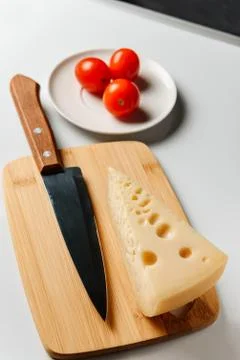 A triangular piece of cheese Stock Photos