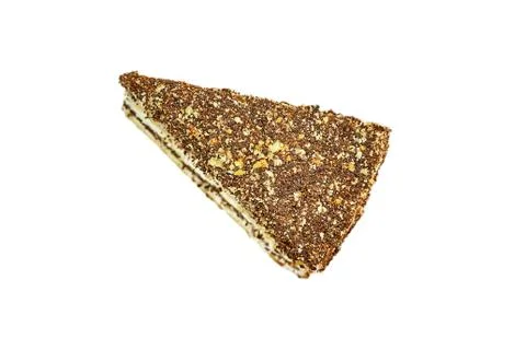 Triangular piece of walnut cake. Fresh pastries, top view. Close-up, isolate Stock Photos