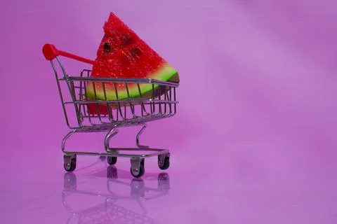 A triangular piece of watermelon in a supermarket cart. Stock Photos