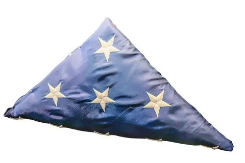 Triangular pillow with patriotic design featuring blue fabric and white emb.. Stock Photos