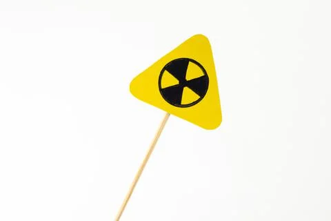 Triangular radiation hazard sign on white Stock Photos