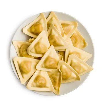 Triangular Ravioli Pasta On White Plate - Fresh Italian Uncooked Dumplings .. Fotos de archivo