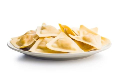 Triangular Ravioli Pasta On White Plate - Fresh Italian Uncooked Dumplings .. Fotos de archivo