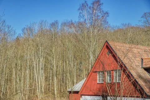 Triangular red facade of a typical Swedish countryside house with pitched roof Foto stock