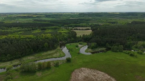 Triangular River Meander – High Altitude Parallax Right Wide Aerial Establishing Stock Footage 335224864