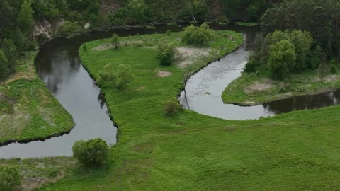 Triangular River Meander – High Altitude Parallax Right Telephoto Establishing Stock Footage 335233995