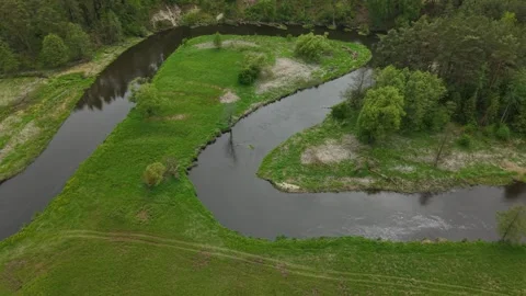 Triangular River Meander – Low Altitude Sideways Left Wide Aerial Motion Stock Footage 335290846