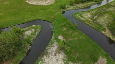 Triangular River Meander – Low Altitude Forward Diagonal Wide Aerial Motion Stock Footage 335299544
