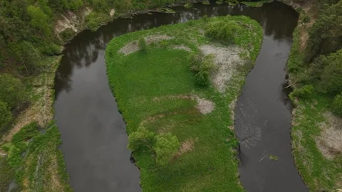 Triangular River Meander – Wide Backward Rise Aerial Tilt‑Up Reveal Shot Stock Footage 335300905