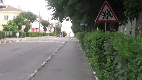 Triangular road sign caution, children on the streets of a small town in Ukraine Vídeos de archivo 312219768