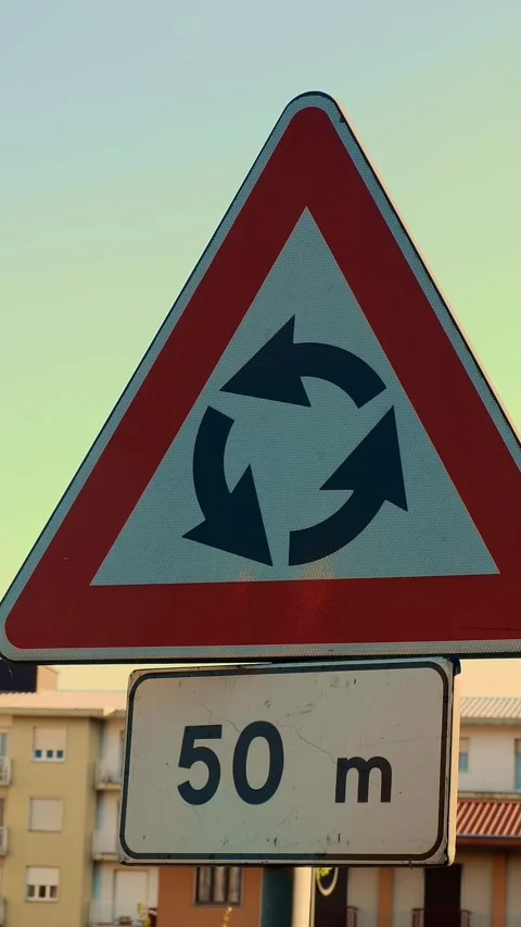 Triangular road sign with red border and black circular arrows with 50 meters Stock Footage 316986106