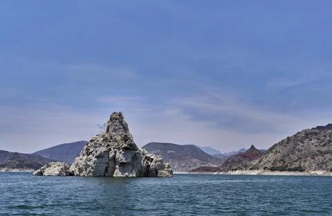 Triangular rock in the middle of the dam 写真素材