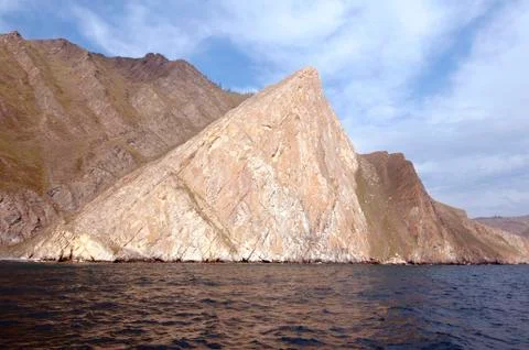 Triangular rock of white marble Cape Orso Lake Baikal Siberia Russia Europe Stock Photos