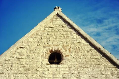 The triangular roof of an old building Foto stock