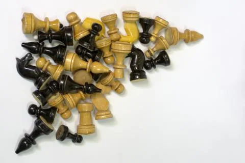 Triangular set of blacks and whites chess pieces in a neat pile Stock Photos