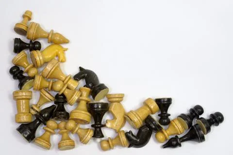 Triangular set of blacks and whites chess pieces in a neat pile Stock Photos