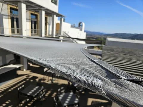 Triangular shade sail made of fabric in a winery in Napa California Stock Photos