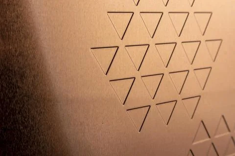 Triangular shape on the surface of copper sheet material Stockfoto's