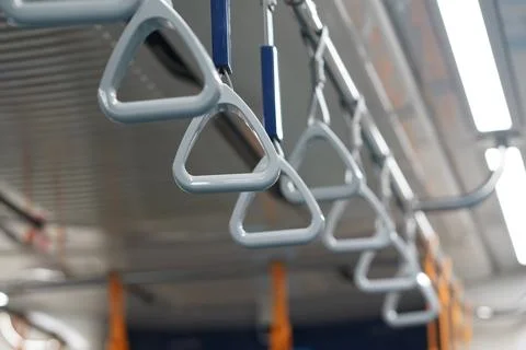 Triangular shaped hand rails inside MRT Jakarta car. The handles are made o.. Stock Photos