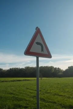 A triangular sign with a red arrow pointing to the right Stock Photos